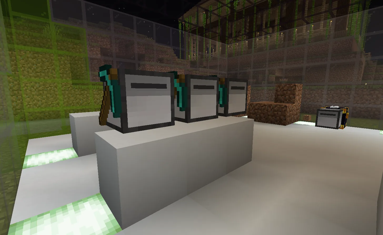 Three white automated mining machines with teal pickaxes mounted on their sides, lined up on a long white bench in a glass-walled room at night, green light strips set into the floor